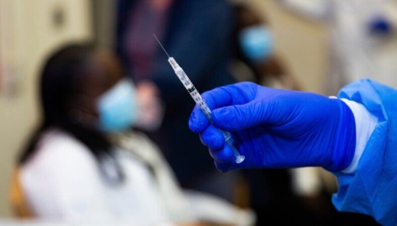 COVID-19 vaccine syringe